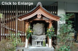 Usuki, Oita Prefecture. Modern. Replica of the famous head of Dainichi Nyorai.