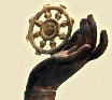 The Dharma Wheel -- Represents the Teaching of Buddhist tenets.
