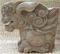 Wooden Shishi, typically found under the eave of Buddhist temples and Shinto shrines.