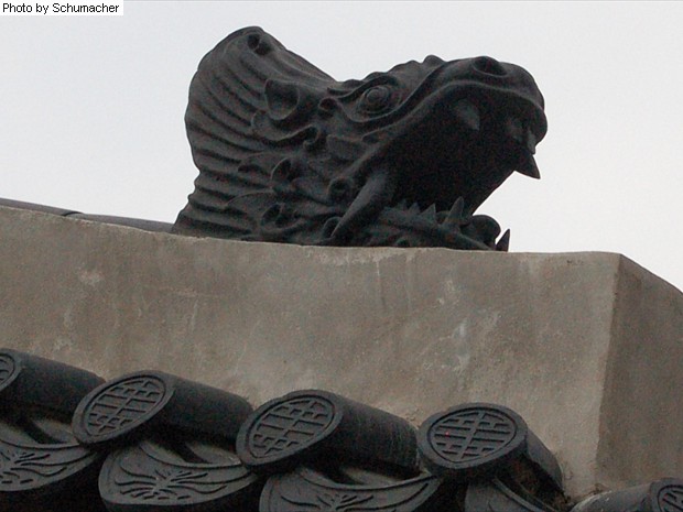 Ceramic roof tile of Makara at Gyeongbokgung Palace, Seoul, Korea. An ancient Vedic sea monster known as Makara 鯨魚 or 摩竭. Commonly positioned on the main ridge of temples & palaces in Korea and thought to protect against fire.