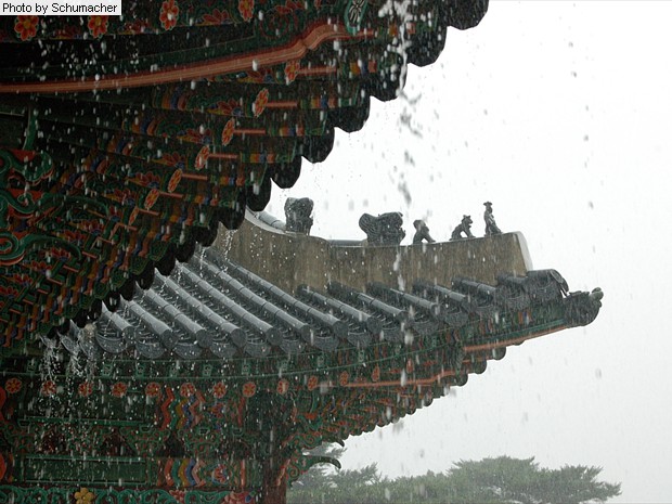 Roof tiles at Gyeongbokgung Palace, Seoul, Korea. The protective rooftop effigies come in various configurations, including groups of three, five, six, seven, and eleven, and meant to protect against fire.