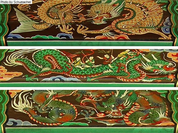 Three dragon paintings among the various structures at Seokjongsa Temple.