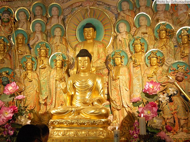 Buddhist carving at Dongguk University Museum. Deities in this image include the Four Heavenly Kings, Kṣitigarbha Bodhisattva, the Historical Buddha, the Medicine Buddha, and other Bodhisattva and Arhats.