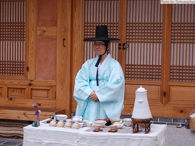 Man serving refreshments at the Asian Art Museum, Seoul, Korea.