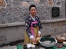 Lady serving refreshments at the Asian Art Museum, Seoul, Korea.