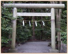 Shinto Torii, or Gate, decorated with the Shimenawa rope and white paper